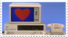 an old computer monitor with a heart on the screen